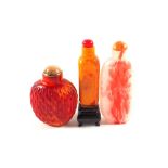 A Chinese mottled pink stone snuff bottle with Red Coral stopper,