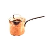 A heavy large 19th Century seamed Copper saucepan with lid and iron handle,