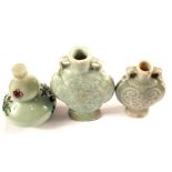 Three Chinese Celadon glazed snuff bottles and one with painted figure decoration