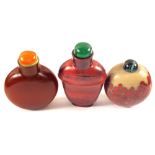 Three Chinese red stone snuff bottles with Red Coral,