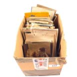 A box of various postcards