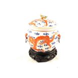 A 19th Century Chinese lidded pot with dragon chasing flaming pearl decoration,