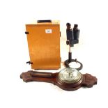 A cased binocular microscope and an Oak barometer