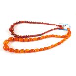 Two Amber coloured bead necklaces