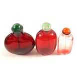 Three Chinese red glass snuff bottles with Red Coral,