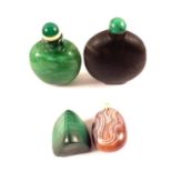 A Chinese mottled green stone snuff bottle with green stone stopper, one Malachite with no stopper,