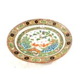 An 18th Century Cantonese oval meat plate with tiger, bird, butterfly and floral decoration,