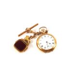 A lady's 9ct Gold pocket watch with a 9ct Gold red stone lion swivel fob and chain,