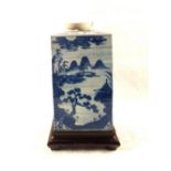 A large 18th Century Chinese blue and white tea caddy with pagoda,