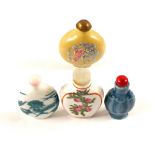 Four Chinese porcelain snuff bottles, blue glazed with red stone stopper,