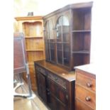 An Oak two door display cabinet with open side corner shelves over an Oak two door,