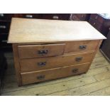 A light Oak chest of two short and two long drawers