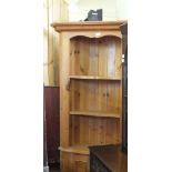 A Pine open shelf corner cabinet