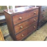 A Victorian Mahogany three drawer chest on turned feet