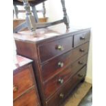 A 19th Century Mahogany chest of two short and three long drawers on turned feet