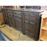 A reproduction dark stained Oak sideboard