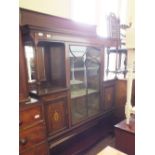 An Edwardian Mahogany display cabinet with urn, leaf and swag inlays, central astral glazed door,