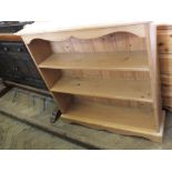 A Pine three shelf bookcase and modern four drawer chest