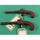 A pair of percussion (conversion from Flintlock) pistols by Wheeler,