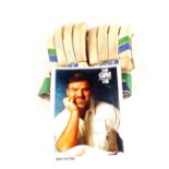 A pair of cricket gloves and photo,