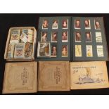 A selection of cigarette cards plus three Silver sports medallions