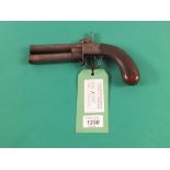 A double barrel percussion turnover overcoat pistol,