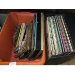 A case and box containing mainly Elvis LP's,