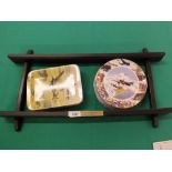 A wooden rack with plaque to display four limited edition plates with Battle of Britain images