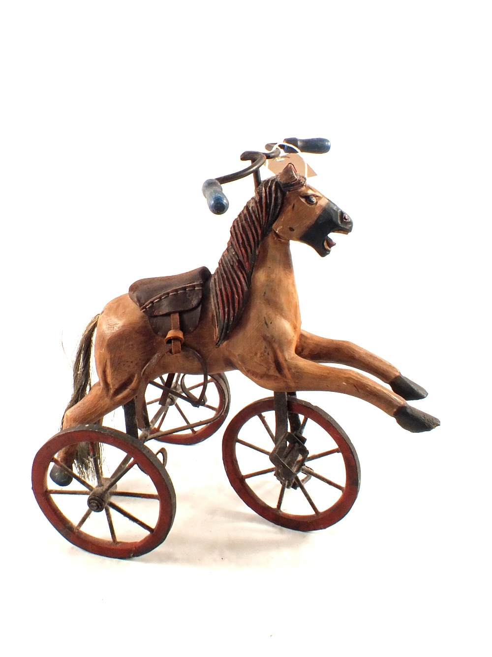 A reproduction wood and metal horse miniature tricycle