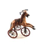 A reproduction wood and metal horse miniature tricycle