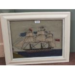 A Victorian needlework of a British frigate approaching a British stronghold