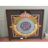 A framed hand painted George VI Royal Army Service Corps insignia,