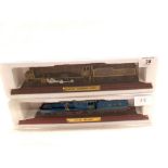 Two static model locomotives on plinths,