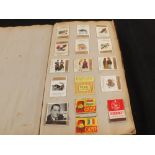 An album of various Matchbox covers and a stamp album