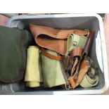 A box of mixed slips and holsters etc with a bag containing shooting jacket,