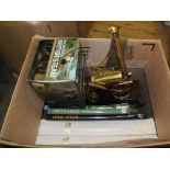 A brass model of a Stephensons rocket and railways books,