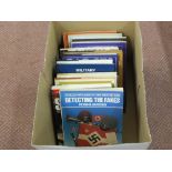 A collection of military related reference books including badges and fakes etc