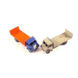 Two unboxed Dinky 513 Guy flatbed with tailboard deep blue cab, chassis, wings, orange body,