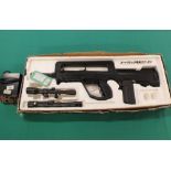 A mixed lot including soft air assault rifle with charger and two CO2 pistols,