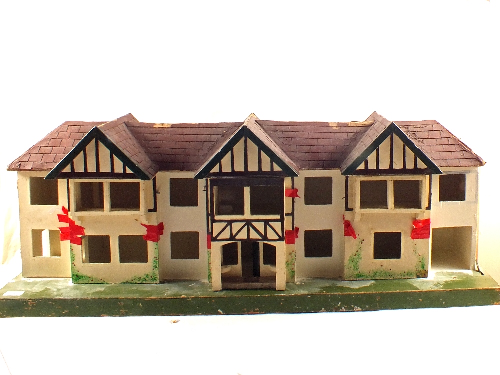 A Triang triple fronted dolls house and windows etc