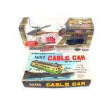 A boxed Cosmo battery operated cable cart silver lit radio controlled helicopter