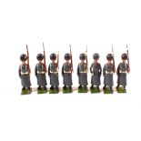 A set of eight 312 Britains Grenadier Guards in winter coats marching at slope including an officer