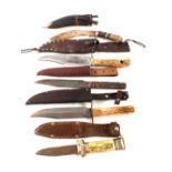 A collection of five knives including a Bowie and a George Butler & Co example