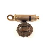 A Tank Corps (PATTERN) Officers bronze cap badge with a whistle marked 1915