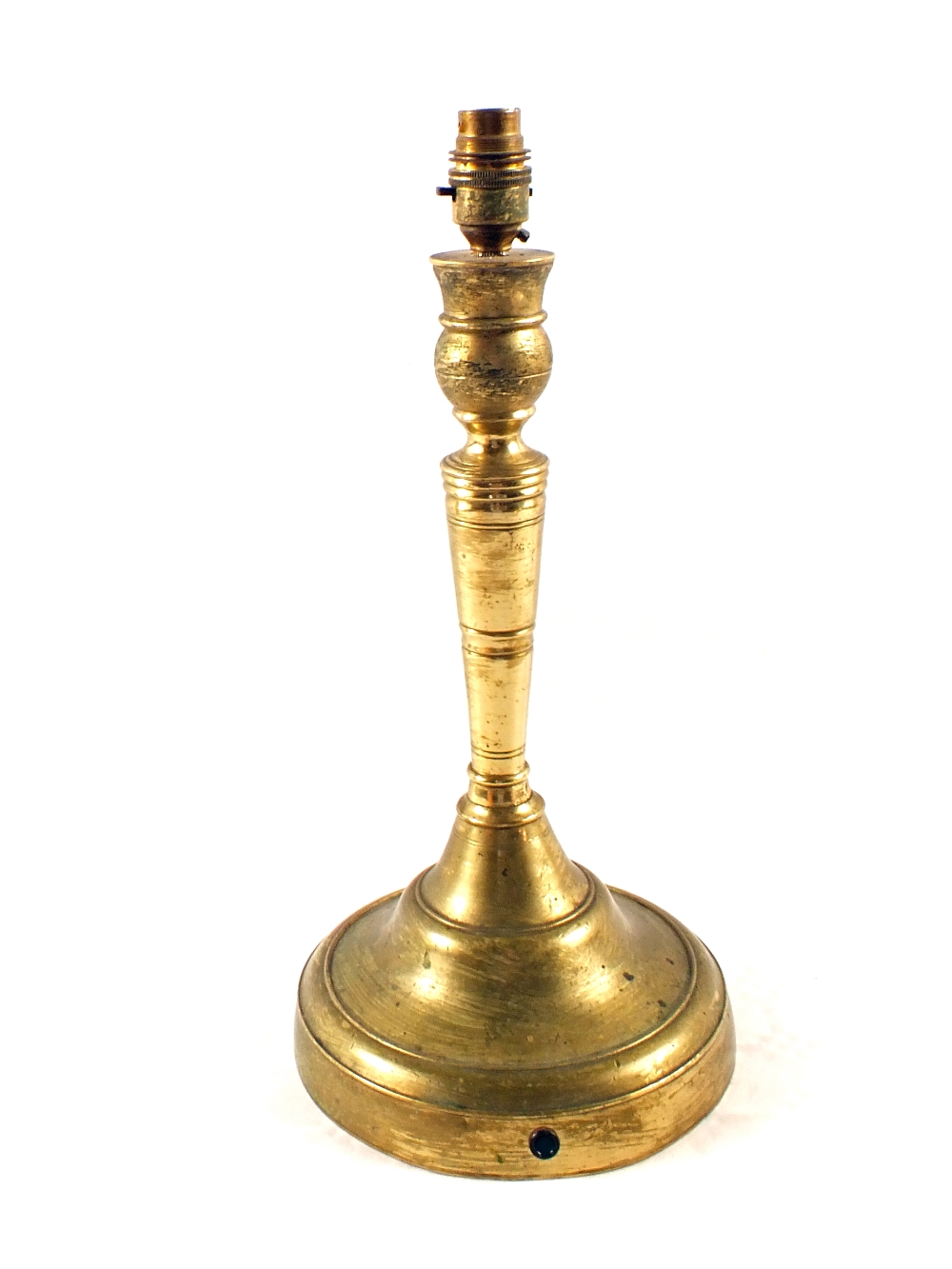 A large 18th Century continental Brass candlestick on wide circular base, 13 1/2" high,