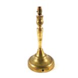 A large 18th Century continental Brass candlestick on wide circular base, 13 1/2" high,