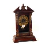 A Mahogany and Brass mounted mantel clock