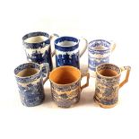 Six 19th Century blue and white mugs including Tiger Hunt (some damage)