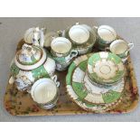 A 19th Century Rockingham style gilt and apple green tea set