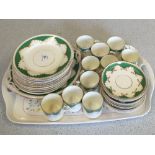 A 19th Century apple green and gilt coffee set and plates